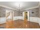 Spacious dining room featuring hardwood floors and an ornate chandelier at 7300 Chattahoochee Bluff Dr, Sandy Springs, GA 30350