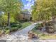 Long driveway approach to a beautiful traditional brick home at 7300 Chattahoochee Bluff Dr, Sandy Springs, GA 30350