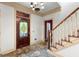 Elegant foyer with ornate stained glass door and staircase at 7300 Chattahoochee Bluff Dr, Sandy Springs, GA 30350