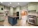 This gourmet kitchen features custom cabinets, stone countertops, and stainless steel appliances at 7300 Chattahoochee Bluff Dr, Sandy Springs, GA 30350