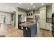 Gourmet kitchen featuring custom cabinets, stainless steel appliances, and a kitchen island at 7300 Chattahoochee Bluff Dr, Sandy Springs, GA 30350