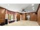 Spacious living room with wood paneling, a bay window, and recessed lighting at 7300 Chattahoochee Bluff Dr, Sandy Springs, GA 30350