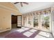 Sunroom with multiple windows and a door to another room at 7300 Chattahoochee Bluff Dr, Sandy Springs, GA 30350