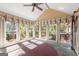 Bright sunroom with multiple windows offering views of the surrounding landscape at 7300 Chattahoochee Bluff Dr, Sandy Springs, GA 30350