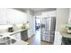 Well-lit kitchen with stainless steel refrigerator at 541 Richmond Pl, Loganville, GA 30052