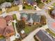 Aerial view showcasing the backyard, patio area, storage shed, and the home's landscaping at 1115 Oakpark Drive Dr, Mcdonough, GA 30253