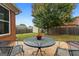 Cozy back patio features a stone surface with a table and chairs perfect for enjoying outdoor living at 1115 Oakpark Drive Dr, Mcdonough, GA 30253