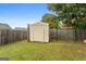Large backyard with green lawn, storage shed, and fenced perimeter is ready for your enjoyment at 1115 Oakpark Drive Dr, Mcdonough, GA 30253
