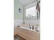 Neutral bathroom featuring a built in soaking tub, tile surround, and decorative window at 1115 Oakpark Drive Dr, Mcdonough, GA 30253