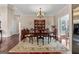 Formal dining room featuring hardwood floors, detailed trim, and a decorative chandelier at 1115 Oakpark Drive Dr, Mcdonough, GA 30253