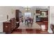 Elegant dining area with hardwood floors, formal furniture, and abundant natural light at 1115 Oakpark Drive Dr, Mcdonough, GA 30253
