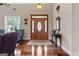 Elegant foyer boasts hardwood flooring, decorative glass door, and stylish decor accents at 1115 Oakpark Drive Dr, Mcdonough, GA 30253