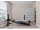 Exercise room with work out equipment, a window, and double doors at 1115 Oakpark Drive Dr, Mcdonough, GA 30253