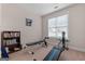 Exercise room with work out equipment, a bookcase, and a window at 1115 Oakpark Drive Dr, Mcdonough, GA 30253