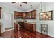 Kitchen area featuring a gas range, wood cabinets, and wine storage at 1115 Oakpark Drive Dr, Mcdonough, GA 30253