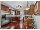 Kitchen featuring stainless steel appliances, hardwood floors, and plentiful cabinet storage at 1115 Oakpark Drive Dr, Mcdonough, GA 30253