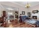 Open-concept living area featuring a fireplace, dining space, and hardwood flooring at 1115 Oakpark Drive Dr, Mcdonough, GA 30253