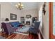 Inviting living area with fireplace, large windows, and attractive wood floors at 1115 Oakpark Drive Dr, Mcdonough, GA 30253