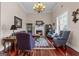 Cozy living room featuring a fireplace, hardwood floors, and neutral color palette at 1115 Oakpark Drive Dr, Mcdonough, GA 30253