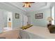 Main bedroom with neutral tones and a door leading to the attached bathroom at 1115 Oakpark Drive Dr, Mcdonough, GA 30253