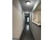 Hallway featuring hard wood floors with open view to living area and kitchen at 3204 Fairington Village Dr, Lithonia, GA 30038