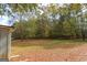 Leaf-covered backyard showing the peaceful and private outdoor space and mature trees at 105 Tranquility Dr, Villa Rica, GA 30180