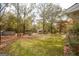 Expansive backyard with mature trees offering shade and privacy, perfect for relaxation at 105 Tranquility Dr, Villa Rica, GA 30180