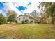 Expansive backyard, highlighting the property's size, mature trees, and deck at 105 Tranquility Dr, Villa Rica, GA 30180
