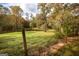 View of a backyard and wooded area at 105 Tranquility Dr, Villa Rica, GA 30180