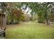 Tranquil backyard view from the wooden deck, perfect for enjoying the natural surroundings at 105 Tranquility Dr, Villa Rica, GA 30180