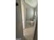 Compact bathroom with a toilet and window; functional and ready for upgrades at 105 Tranquility Dr, Villa Rica, GA 30180