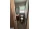 This is a bathroom featuring a sink, vanity, toilet, and a window for natural light at 105 Tranquility Dr, Villa Rica, GA 30180
