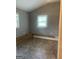 Empty bedroom with gray walls, wood trim, and two windows with blinds; ready for personalization at 105 Tranquility Dr, Villa Rica, GA 30180
