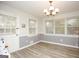 Bright dining room with ample natural light from multiple windows and stylish chandelier at 105 Tranquility Dr, Villa Rica, GA 30180