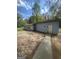 Exterior of home with gravel area at 105 Tranquility Dr, Villa Rica, GA 30180