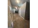 Hallway view showing a glimpse of the kitchen, offering a sense of space and flow at 105 Tranquility Dr, Villa Rica, GA 30180