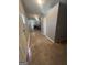 Hallway view showing a glimpse of the kitchen, offering a sense of space and flow at 105 Tranquility Dr, Villa Rica, GA 30180