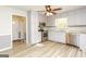 Well-lit kitchen with stainless appliances, plentiful storage, and laminate wood flooring at 105 Tranquility Dr, Villa Rica, GA 30180