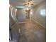 An open-concept living room showcasing its size and natural light with a refrigerator at 105 Tranquility Dr, Villa Rica, GA 30180