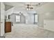 Spacious bonus room featuring carpet flooring, ceiling fans, and ample natural light at 684 Brooks Woolsey Rd, Brooks, GA 30205