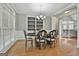 Formal dining room with hardwood floors and a built-in bookshelf at 684 Brooks Woolsey Rd, Brooks, GA 30205