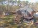Beautiful brick home with an expansive back deck, outbuilding, and lush green lawn, offering privacy and space at 684 Brooks Woolsey Rd, Brooks, GA 30205