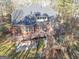 Stunning brick home featuring a spacious deck and stairs, perfect for outdoor relaxation and entertaining at 684 Brooks Woolsey Rd, Brooks, GA 30205