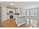 Well-lit kitchen with modern appliances, white cabinets, and hardwood floors at 684 Brooks Woolsey Rd, Brooks, GA 30205