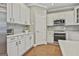 Clean kitchen featuring modern appliances and white cabinetry at 684 Brooks Woolsey Rd, Brooks, GA 30205