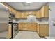 View of the kitchen featuring stainless steel appliances, tile flooring, and bright cabinets at 684 Brooks Woolsey Rd, Brooks, GA 30205