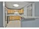 View of the kitchen featuring stainless steel appliances, granite countertops, and bright cabinets at 684 Brooks Woolsey Rd, Brooks, GA 30205