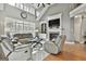 Bright living room with large windows and hardwood floors at 684 Brooks Woolsey Rd, Brooks, GA 30205