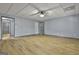 View of the spacious living room with wood floors, neutral paint, and easy access to other rooms at 684 Brooks Woolsey Rd, Brooks, GA 30205