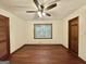 Spacious bedroom with hardwood floors, ceiling fan and large window at 1450 Victoria Ln, Oxford, GA 30054